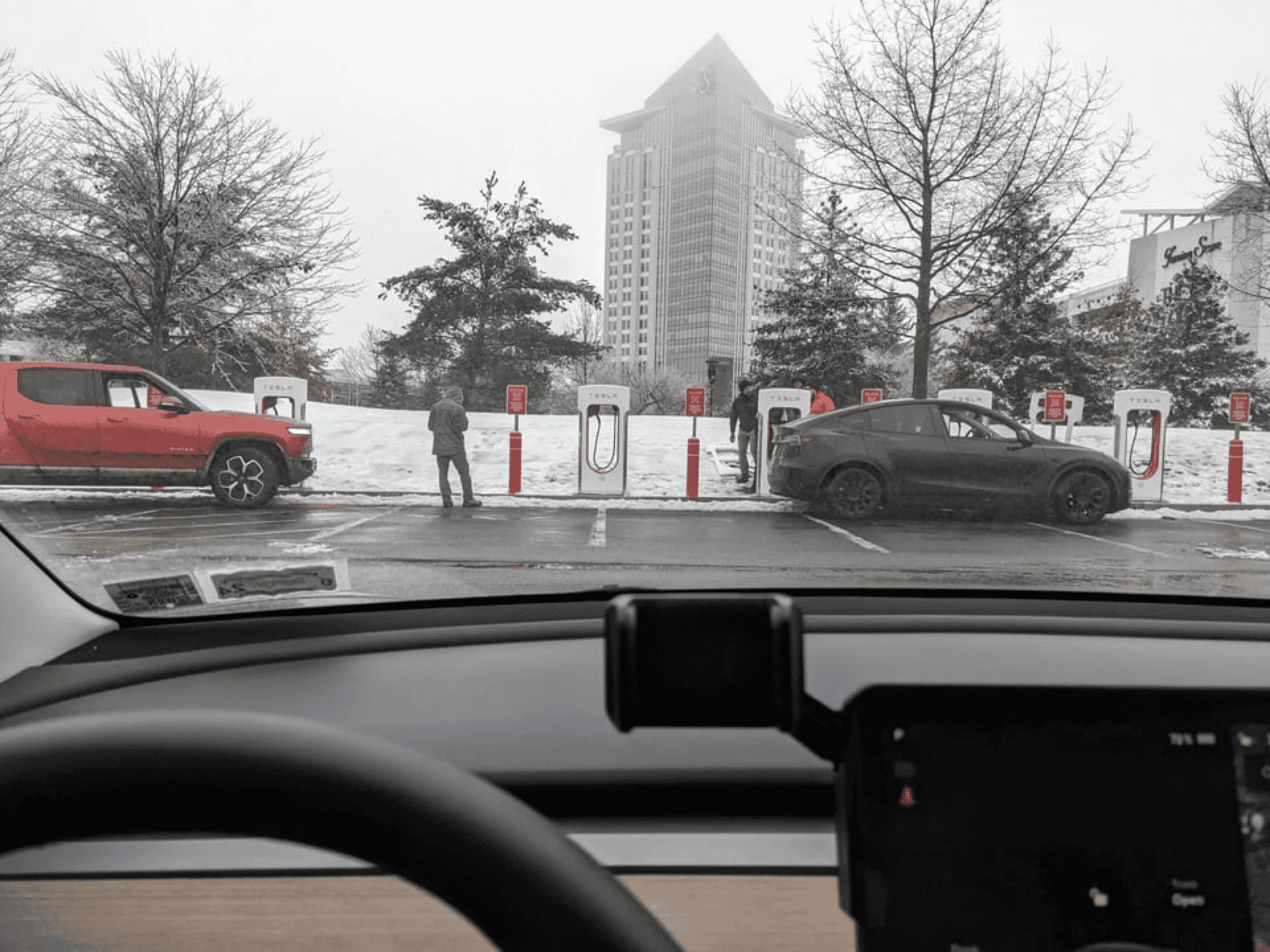 Tesla Model 2 First Supercharger with Magic Dock CCS Adapter charges up a Rivian 1677186197072