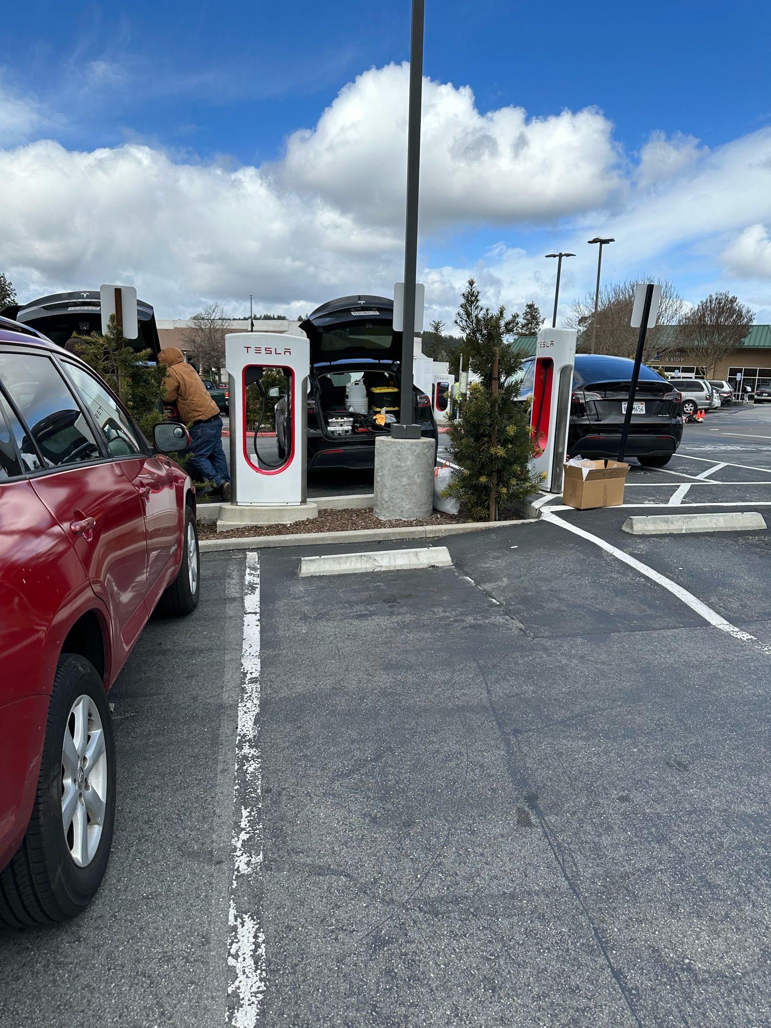Tesla Model 2 First Supercharger with Magic Dock CCS Adapter charges up a Rivian tesla 3
